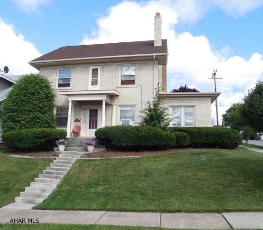 Character abounds this 3 story, 4 bedrm., 2 bath  brick Georgian Colonial with natural woodwork throughout. Cheery, bright sunroom with brick fireplace and terra-cotta floor. Living rm with stone fireplace. Newer kitchen with corian countertops, tile floor, and breakfast bar. Dining rm with beautiful arched window. Finished 3rd floor with a bedroom and great storage area. Finished lower level with bathrm. This home has been well maintained with newer windows,furnace(2 zoned) and roof. Backyard is a hidden treasure w/stone patio and beautifully landscaped. Det. brick 2 car garage. Don't wait on this Very Special home!!