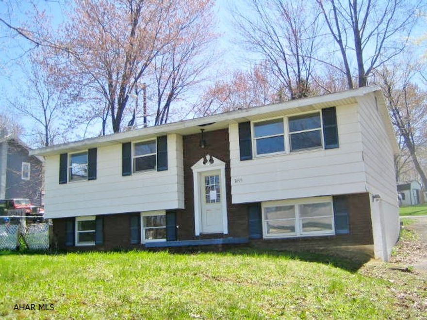 CRESSON AREA BI-LEVEL in need of some TLC. This home is a great opportunity for the right buyer. Nicely updated kitchen with large dining area, spacious formal living room, 3 bedrooms and 2 full baths. Semi-finished basement, large wood deck, off street parking, 2 zone gas hot water heat. AS-IS addendum required. Seller will make no repairs.