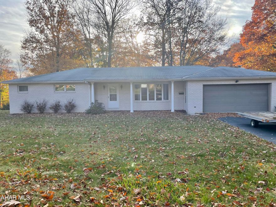 Captivating home in Windber situated on over 1/2 of an acre of land on a picturesque corner lot within Windber Area School District. With over 2,700 sq ft between the main level and the finished basement, this house has plenty of space to transform into your own. The stunning white brick and covered front patio supported by columns are sure to catch your eye at a first glance. Entering through the front door, you'll find yourself in the spacious living room with beautiful hardwood flooring. As you work your way through the house, it's hard not to notice the intricate details of the plaster work on the ceilings. Working your way down the hallway, you'll notice the spacious master suite with a double vanity in the bathroom. Just across the hallway, you'll find the second spacious bedroom with eye-catching plaster work on the ceilings and a second bathroom. On the other side of the main level is the dining area and newly renovated kitchen with a brand new oven and stove, microwave, and dishwasher that have never been used. One the other side of the kitchen lies an extra living space with a fireplace and entrance to the over 300 sq ft wooden deck with beautiful views. As you work your way down to the finished basement, you'll find this house has even more to offer. A game room, office space, exercise room, additional bedroom, the possibilities and potential this space has is endless. An additional bedroom connected to a bathroom also encompasses this space. There is no shortage of storage space either, as a full walk-in closet sits right next to the bedroom and bathroom area. Both central air and a central vacuum system are some of the other things this home has to offer. This home has even more to offer on the outside. Aside from an attached 2 car garage, there's also a 3-car detached garage spanning over 700 sq ft. Come and see all this beautiful home has to offer for yourself. Call, text, or email to schedule a showing!