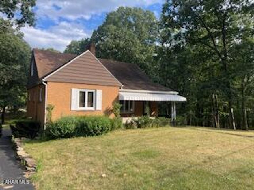 Charming 1959 One-Owner Home on a Spacious Lot! This solid, well-cared-for 2-bedroom, 1.5-bath home is full of original charm and untapped potential. Nestled on a generous lot, this property offers space to breathe and room to grow —
ideal for those seeking land, vintage charm and potential. Inside, discover a cozy living room with a wood-burning fireplace, central air for year-round
comfort, and original wood floors hidden beneath the carpet, ready to be brought back to life. The kitchen is compact and original, ready for a full makeover — a blank slate for your dream
design! The full basement is partially finished and features a half bath, walk-out access, and endless possibilities for additional living space, a workshop, or in-law suite. An attached one-car garage adds convenience, while the layout and lot offer flexibility for future upgrades or additions. This home has been lovingly maintained by the original owner and is
ready for its next chapter. Whether you're an investor, a first-time buyer ready for a project, or someone seeking space
and serenity, this home offers value, land, and possibility.