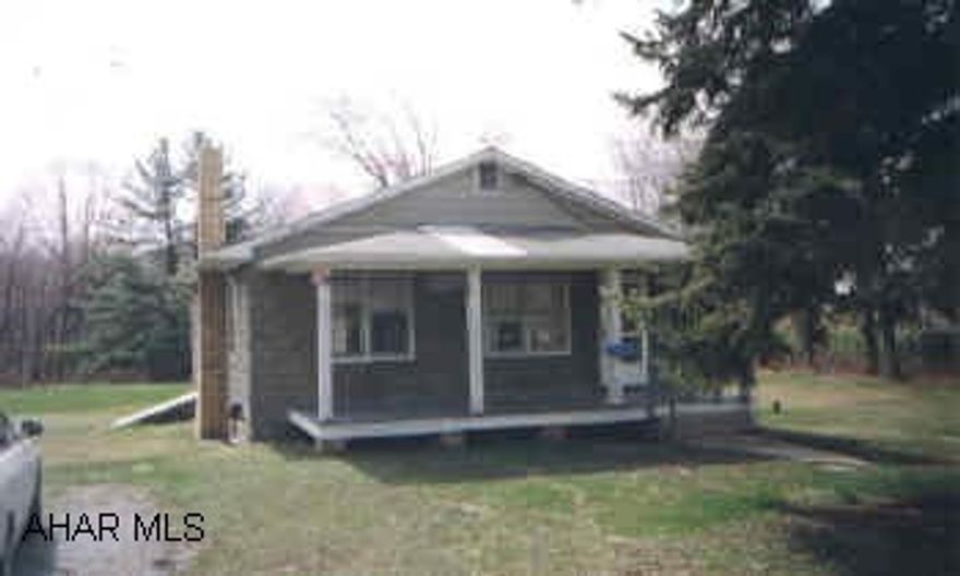 2 BEDROOM HOME LOCATED ON A LEVEL 2.54 ACRE LOT WITH STORAGE SHED AND 2 CAR DETACHED GARAGE. NEW OIL HW FURNACE. TAKE 865 THRU BELLWOOD TURN RIGHT AT BACK ROAD TO TIPTON. HOUSE IS ONE THE RIGHT. PROPERTY TO BE ASST. FOR PUBLIC SEWER.