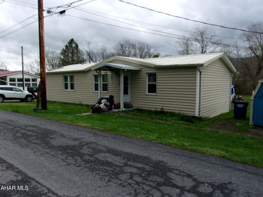 Spacious doublewide on rented lot. Quiet area, minutes from town.  Nice back yard. Lots  of parking.  Small covered side porch.