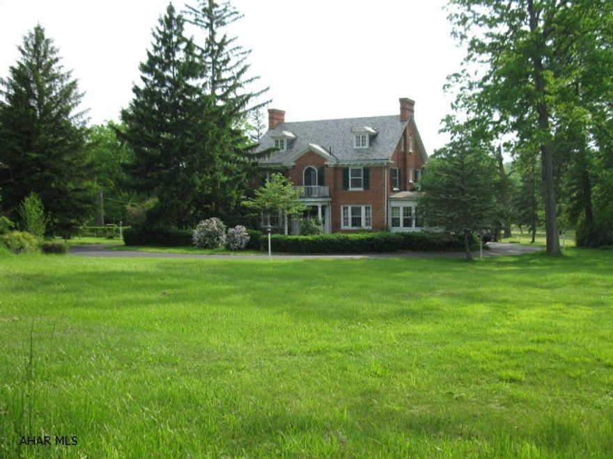 CLASSIC 12 ROOM GEORGIAN BRICK WITH LARGE FORMAL ROOMS, CENTER FOYER WITH LEADED GLASS AND GRAND 3 STORY WINDING STAIRCASE.  THIS ELEGANT ROARING 20'S LADY IS A BEAUTY WITH STYLE AND UNLIMITED POTENTIAL! 2.5 ACRE GROUNDS HAVE MATURE LANDSCAPING, CIRCULAR DRIVE, 4 CAR GARAGE.  TLC NEEDED - SELLING AS IS.  OUTBUILDINGS AND INGROUND POOL NEED TOTAL RENOVATION OR TO BE TORN DOWN. ORIGINAL FURNACE AND SLATE ROOF. QUALIFIED BUYERS BY APPOINTMENT ONLY.  NO DRIVE BYS.