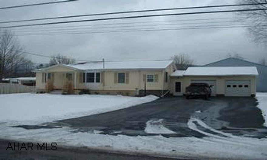 Excellent condition inside & out. New composite decking and sidewalks, new flooring, newer kitchen and roof.  1st floor laundry, heated garage. Large level lot.  Not in a flood zone!