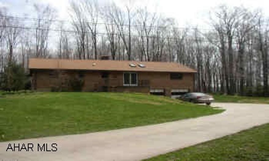 SO WELL MAINTAINED. VERY OPEN FLOOR PLAN. UNIQUE DEN. FAMILYROOM W/FIREPLACE. SUPER NICE KITCHEN. SKYLIGHT. STONE FIREPLACE. CERAMIC TILE & SLATE FLOORS. HUGE BASEMENT & GARAGE. PRIVATE LOT. A MUST SEE!  SHED W/UTILITIES & 2 STOVES. SHED HAS 2 LARGE ROOMS PLUS A BATH.