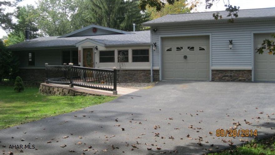 Two bedroom ranch with large rear addition including an ADA bath. In-ground pool in back yard.