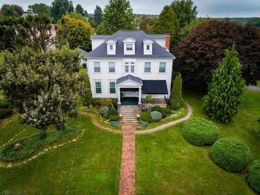In 1898, Dr. Thomas Levi Gibson, Cambria County Superintendent of Schools, built this home. He sold it in 1904 to Senator Tompkins. The Tompkins Family maintained the home until the 1920's.  This grand home includes the beautifully-landscaped lot on the other side of the alley. Being located in a rural community, it qualifies for a USDA loan (no money down), and the sellers will pay $12,000 towards buyers' closing costs. You MAY be able to purchase this home with NO OUT-OF-POCKET MONEY.  Newer roof, siding, insulation, windows, water line, sewer line, gas line, gas hw furnace & water heater.  We have an estimate from a reputable contractor to remove all wallpaper for $3100. He would charge an additional $5000 to repaint all the walls and trim.  So much charm, you won't want to leave!
