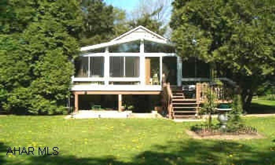 Truly gorgeous 1.9 acre garden retreat-totaly landscaped, to include pond, stream, bridge, dock, gazebo, and picnic/pavillian area. 2-3 bedroom home with  new sunroom to view landscape.