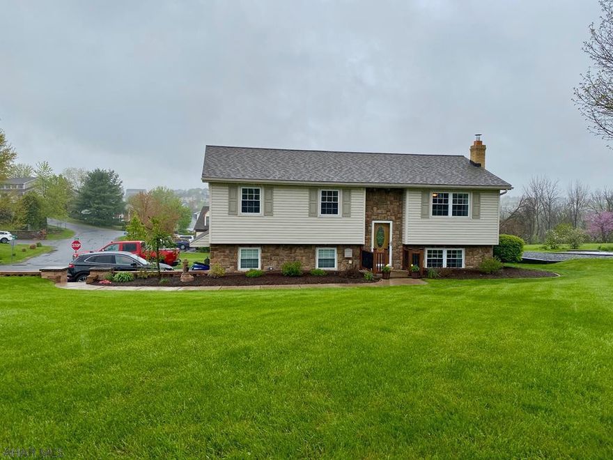 Impeccably cared for beauty on a beautifully landscaped corner lot. Bring your family home and move right in and enjoy all this home has to offer. Open flowing floor plan, Gorgeous laminate floors, new modern & tasteful lighting fixtures & paint, pantry, garage, fireplace, great closets, and more! Lower level is completely finished with 2 great spaces to use however fits your family's needs. Family room leads to the patio and back yard, Dining room leads to the deck to enjoy the breathtaking views. Nice big shed features a new roof and it's own driveway. Pictures speak for themselves... take a look.