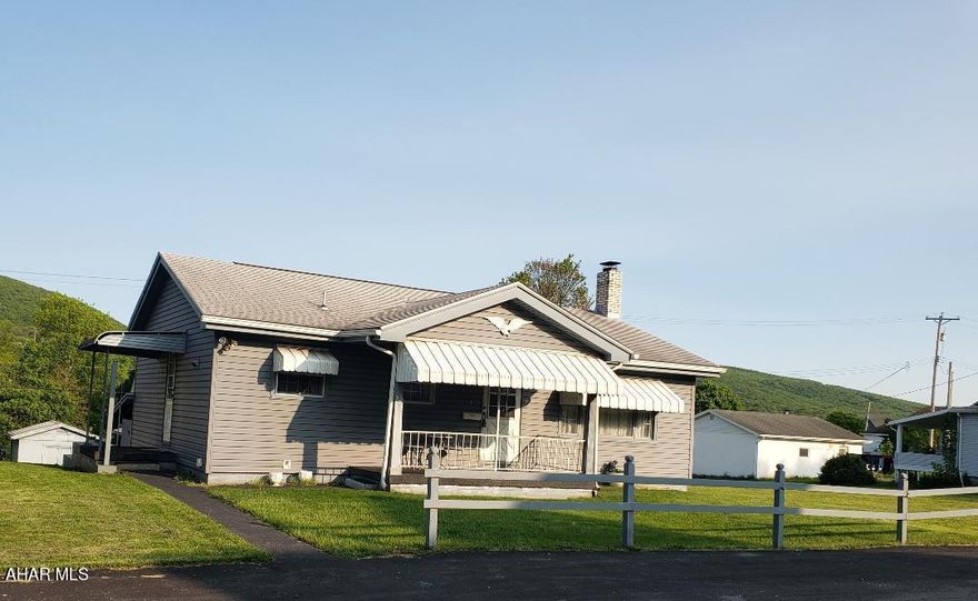 2-bedroom vinyl-sided 1-story home, with natural gas heat and back-up coal furnace, detached 2-car garage + rear alley in nice neighborhood on .35 Acre Lot. J-621