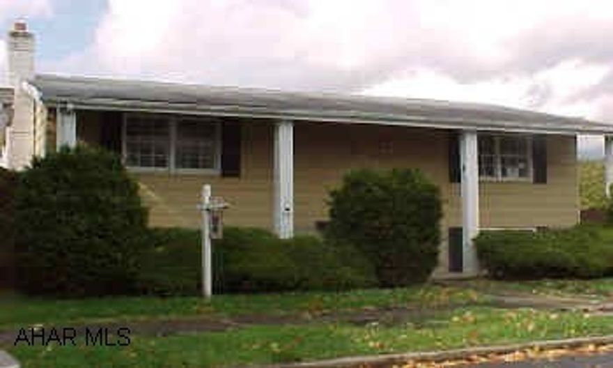 Raised Ranch - Split Entry - Yellow, white trim - Evergreen shrubbery at front - Large landscapedlot - Interior completely refurbished Like New:  New ceilings, floor covering, interior/exterior doors, kitchen.  All appliances. Family Room w/wood panel walls over brick wainscot, features woodburner - Beautiful Kitchen w/Dining Area - Custom installed - Oak Railing/Balusters at split entry foyer w/w seamless carpet - "Gym Area" & Laundry features w/w carpet -