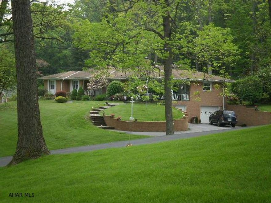 Large Brick Home on 4.5 acres in Meadowbrook Terrace. Lovely sprawling ranch that is a rare find located on a private dead end road but still walking distance to Downtown Bedford! The private back yard sits against hundreds of wooded acres with an abundance of wildlife for viewing. Home offers 4 large bedrooms, 2.5 baths, formal dining room, sunken living room with fireplace, large family room with fireplace and patio doors, eat in kitchen, large laundry. two covered front porches ,large 13x30 back yard patio, paved drive, 2 car garage, shed. Downstairs game room , granite bar, and several storage rooms. New kitchen appliances, new windows, garage doors,paint, carpet and flooring. Agent owned