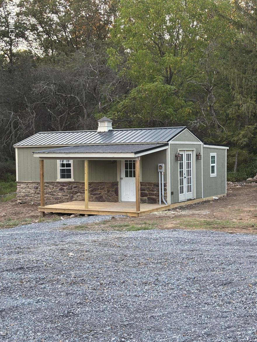 Looking for a low-maintenance getaway? This 300 sq ft tiny home offers everything you need in a compact space--all within minutes of Lake Raystown. Featuring public water, sewer, and electric, the home includes a full bathroom for convenience. Outside, you'll find room to park your boat or expand on the lot to suit your needs. The property's location provides easy access to State Game Lands for outdoor recreation, and it sits within the Tussey Mountain School District. Whether you're seeking a cozy retreat, hunting camp, or base for lake adventures, this property is ready to welcome you.
Private Remarks: Tiny home is not on a foundation but does have public water, public sewer, electricity, and heat and AC.
This home can not be used as a primary, year round residence.