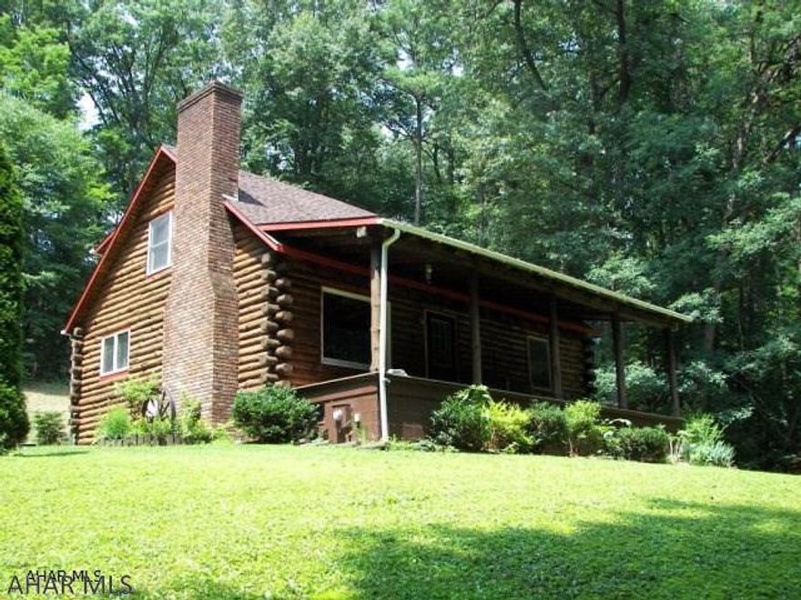 Looking for convenience and privacy?   Conveniently located between State College and Altoona, this 3 bedroom and 2 bath log home is nestled among 3.17 wooded acres and offers views of beautiful Warriors Mark.  In addition to the family room and covered porches, this home also offers a two car detached garage.  For those who love the outdoors, you are minutes from Spruce Creek, Rails to Trails, State Game Lands, and Raystown Lake.  Don't miss your opportunity, call today for your personalized showing.
