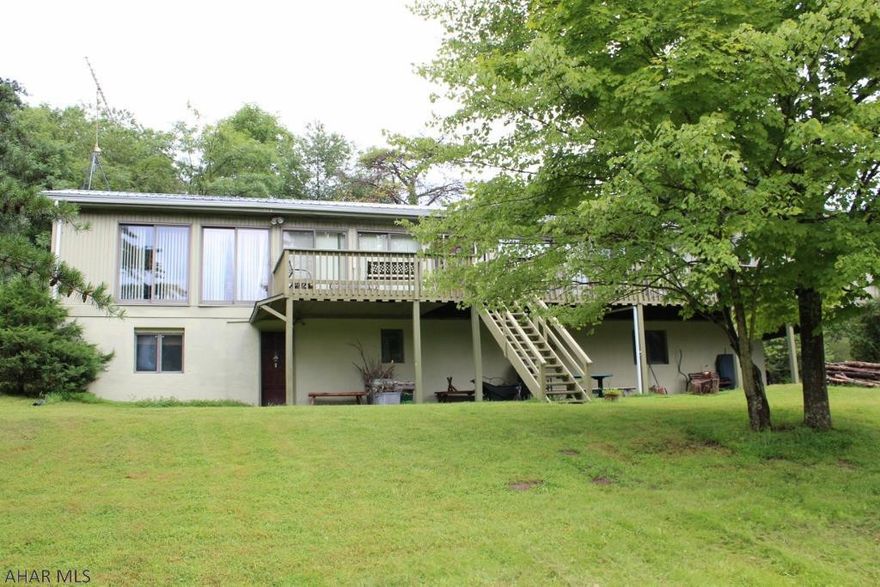 Escape from the hustle and bustle to this beautiful hideaway in Southern Bedford County offering 4 bedrooms and 3 baths. The large deck overlooks a 2 acre pond and would be the perfect spot to start the day with a cup of coffee or end the day just taking in the gorgeous, peaceful scenery. The grassy knoll by the pond would make a beautiful location for family picnics or evening bonfires with friends. Fully finished basement includes in-law suite complete with kitchenette, living area, bedroom, bathroom w/ jacuzzi tub and office space. Detached 2 car garage features a guest quarters above... all situated on 38 private acres close to state game lands, the beautiful Buchanan State Forest and just minutes away from Rocky Gap resort.