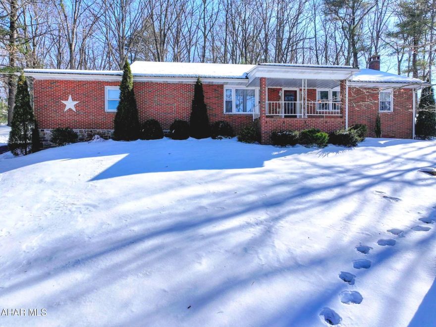 Hard to find one level living Full Brick Ranch Home. Circular paved driveway for easy access in and out. Drive around back to the 2 car garage which has lots of  good space, has pull downsteps to the attic storage. Walk in the back door to the eat-in kitchen. Lovely hardwood flooring in the living room and under carpets in the bedrooms. Laundry hook-ups have been moved to main floor. Basement is finished with family room featuring a gas or wood fireplace, 2nd kitchen and 2nd bathroom area. Bonus room in basement that could have many uses.  Outside enjoy the  large yard with a great view. Heat is oil F/A along with central air. Private well and sewer. Call today for an appointment to make this your new home!