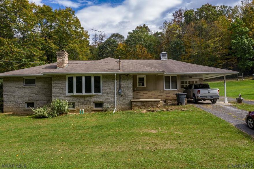 Beautiful updated ranch style home with a full finished basement, attached garage and detached garage. Lots of land and gorgeous views.