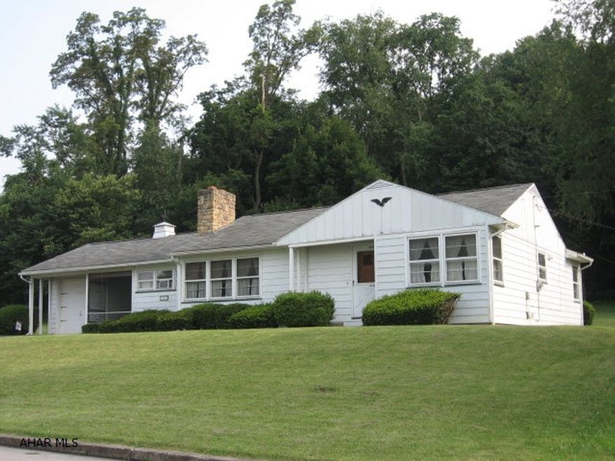 Nice rancher on a big lot in Williamsburg. Big LR w/stone fireplace, foyer area, dining area w/sliding doors to the back patio. Kitchen has lots of cabinets & eat-in area plus a big window w/view to back yard lined w/trees. Currently has open laundry area near kitchen that can be nice entrance/mudroom off the 9x28 screened-in breezeway. Master Bedroom has his/her closets and nice corner windows. 2nd BR has closet w/built-in drawers & corner windows. Home was built by current owner & well-maintained.  Lots of new in 2006 - roof, furnace, new panel box, more outlets per room, steel cellar door, handrails @ steps, basement windows. Hardwood floors throughout underneath the carpet. One-car garage. Full unfinished basement has room for expanding - has toilet, shower, sink. Many possibilities!!