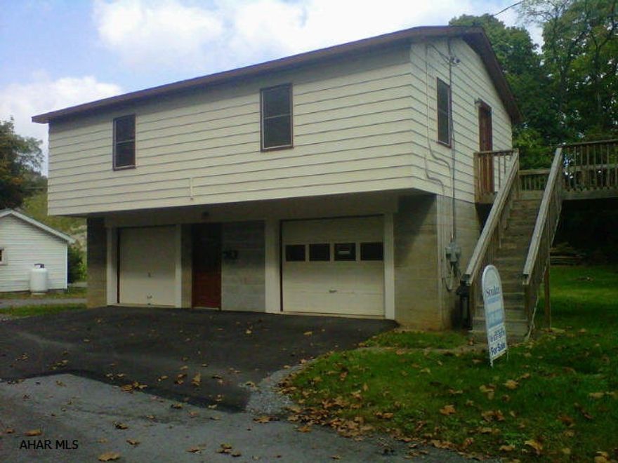 Cozy Raised Ranch...This 2 bedroom, 2 car garage w/ black top driveway and large deck sits on almost an acre of ground. Close to rails to trails, great area for kayaking and fishing.