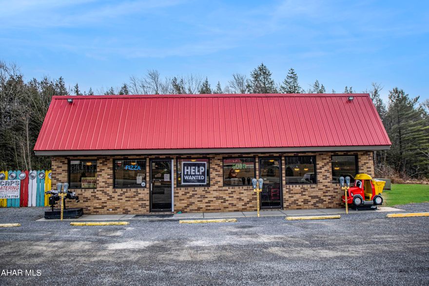 Fully Established Restaurant Business and Real Estate Package! Conveniently situated near Patton, just across from the local high school and a mere 8 minutes from Lake Glendale Marina, this turnkey restaurant offers a prime location. Specializing in pizza, salads, wings, calzones, stromboli's, and subs, the business is located on a spacious 3.7-acre lot with ample parking, and a shed.