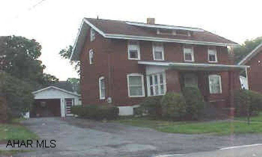 2 1/2 story Brick house with detached garage.  Finished unheated attic for storage. New vinyl windows except front of house.