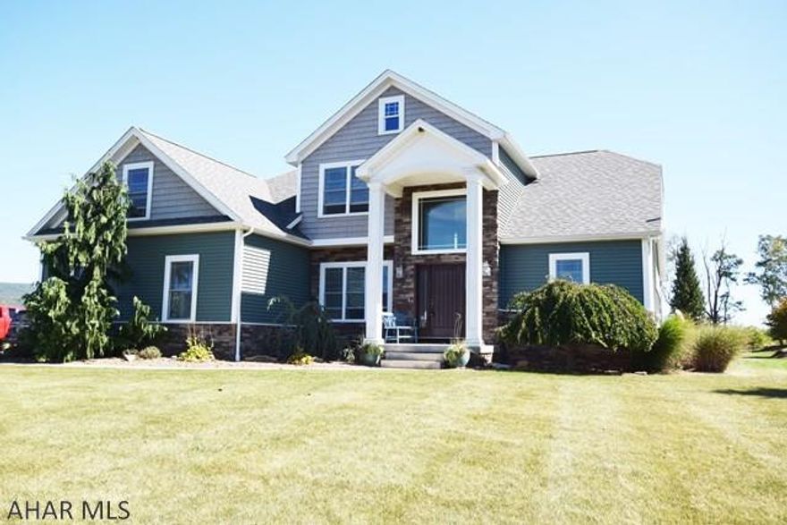 Must see this amazing home settled on almost two acres in beautiful Bradford Heights development! There are 5 bedrooms and 3.5 baths in this open layout design with a loft overlooking the living room and fireplace.  The finished basement, equipped with a handmade bar and movie theater room, is absolutely perfect for evenings in or entertaining.  Enjoy the scenic outside by cooling off at the in-ground pool while having some refreshments at the outside custom built patio bar.  At night time, have fun making s'mores and telling ghost story's around the stone fire pit!  The craftsmanship is impeccably done as this is a custom built home by Castle & Crossman.  If you have been looking for a spacious, open layout, custom built home with a pool and scenery then look no further! Call Today!