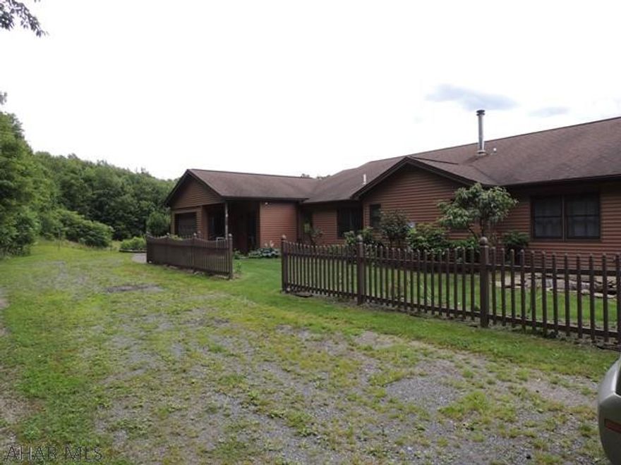 Great Rustic farmette!! 10 acres surround the home which offers 2 bedrooms LR. renovated Kitchen, vaulted ceilings, 1 3/4 bath. Basement features Family room w/ wood burner, 2 bedrooms, 3/4 bath, storage rooms galore, 2 car carport. . and that is not all. also included is an in law suite with kitchen, living room, bedroom & a 3/4 bath w/ laundry hook ups.attached garage  Wait there is more!! There is a 2 story barn w/5 stalls, electric and water. fenced pasture, pond. garden, shed.