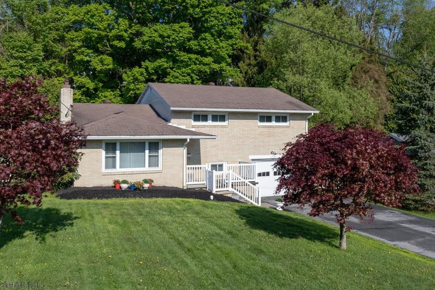 Wonderful brick multi level home in Ebensburg ready for you to move in.  This 3 bedroom home 1.5 bath is located in established neighborhood with a 3 Season's Room, fenced in back yard.  Home has H/W flrs. in LVrm and bedrooms, central air, all new windows.  Lower level offers a bonus space presently used as a exercise room.  Basement area is partially finished with a potential F/P (current owner never used), and additional storage.  Attached garage.  Don't miss out!
