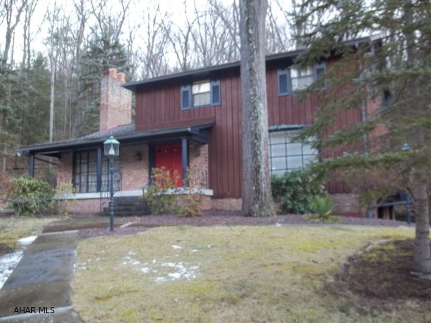 Amazing custom built 2 story home with 3 large bedrooms with hardwood flooring, 2.5 baths, beautiful brick FP in the over-sized family room with large bow window, large Living Room with a large bow window to enjoy the surrounding landscaping and woods,kitchen with floor to ceiling windows and a Dutch door facing the woods.This home has so much potential.  It is solid, but needs a little updating.