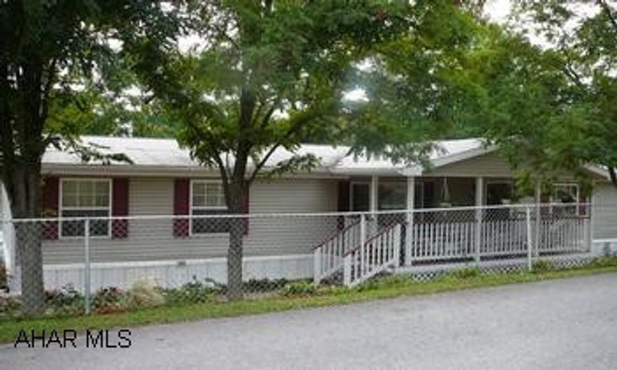 COVERED FRONT AND REAR DECK.  LANDSCAPED.  EACH BEDROOM HAS WALK-IN CLOSET.  MASTER HAS GARDEN TUB AND SHOWER STALL.  BREAKFAST BAR.  FENCED YARD.  SHED.  GRAVEL DRIVE WITH PARKING AREA.  INCLUDES REFRIGERATOR, GAS RANGE, DISHWASHER, WASHER, DRYER.  $245 LOT RENT INCLUDES TRASH AND ROAD MAINTENANCE.  LARGE LOT.