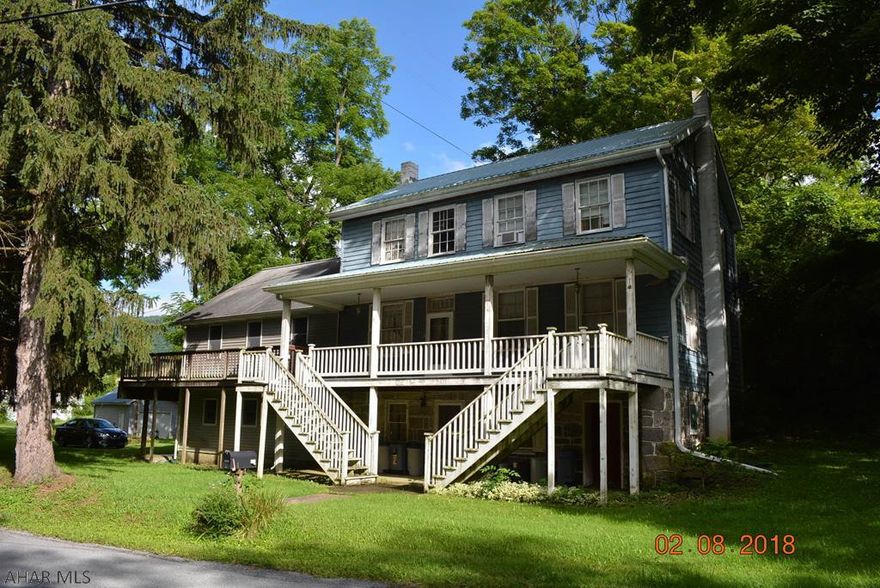 This is a great farmette in need of some TLC.  The house has three levels with kitchenettes and baths on each level.  The first and second levels each have two bedrooms and the lower level has one bedroom.  The property has been used as a bed and breakfast, and as a milking farm.  The barn has two floors for animals, equipment, or storage!  Great quiet location with the creek bordering one side and pasture fields bordering two other sides.  Lots of acreage to work with.  Come see this diamond in the rough!