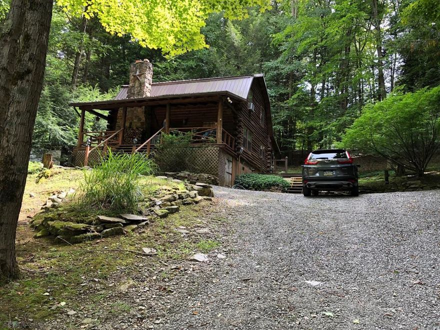 Beautiful 2 bedroom and 2 bathroom LOG cabin with 2 car detached garage on 1 acre inside Glendale Yearound. This could be your weekend getaway or even permanent residence. Cabin is “turn-key” ready and fully furnished. Ready to use right now!!! Kitchen and both bathrooms have been updated. Real wood fireplace with 1 cord of wood ready to burn. Spacious 2 car garage has large room above that could be workshop, storage, etc. Glendale Yearound is a gated community located minutes from Glendale Lake and Prince Gallitzin State Park. Community pool, tennis, basketball, security, and more.