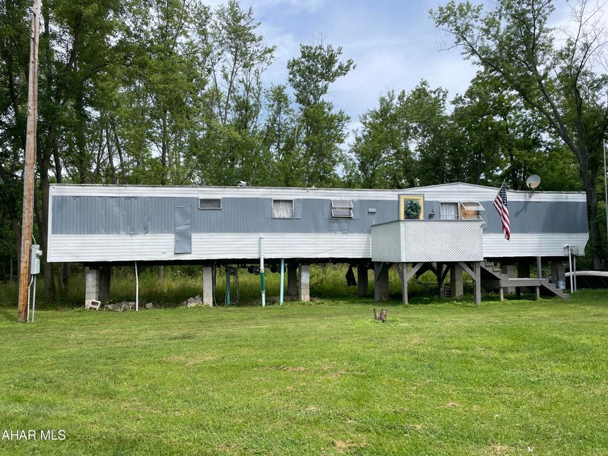 This Property is situated  on 2.78 acres along Dunnings Creek. If your looking for a great location for your getaway home this is it. The Trailer is old and need of rehab.  But some TLC you could have a great place for your weekend or full time home.  With 2 almost 3 acres you could relocate to a very private setting..