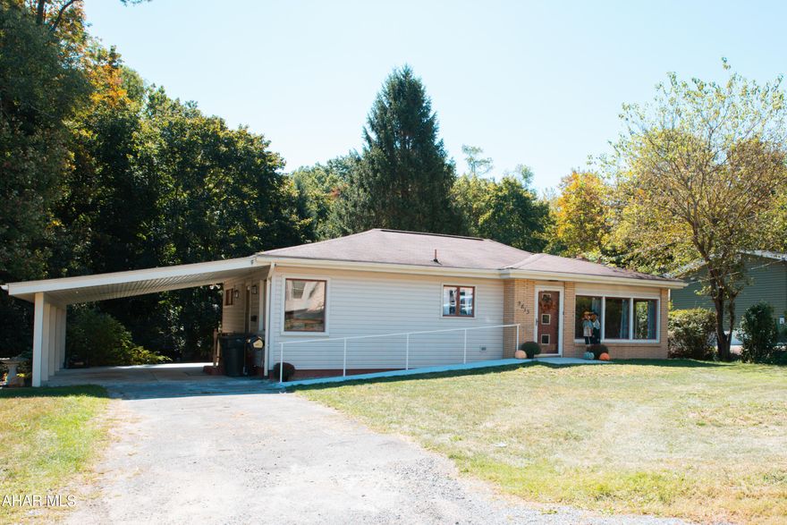 Move-in ready single-story ranch living with a carport! RAMP ACCESSIBLE front entrance. Enjoy an awesome backyard on nearly 0.40 acres- open grassy space just off the carport, with beautiful mature trees providing shade across the back half of the yard. Inside, you'll love the stunning natural light, refinished hardwood floors, and a fully updated kitchen. This home features a Natural Gas Central Air and Heating system, walk-in shower, and convenient first-floor laundry. Major maintenance and updates have already been completed, offering peace of mind and true move-in ready comfort.
