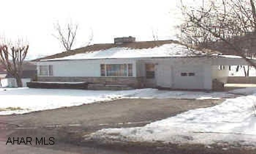 Well built ranch.  Carpet over hardwood floors.  Stone fireplace.
