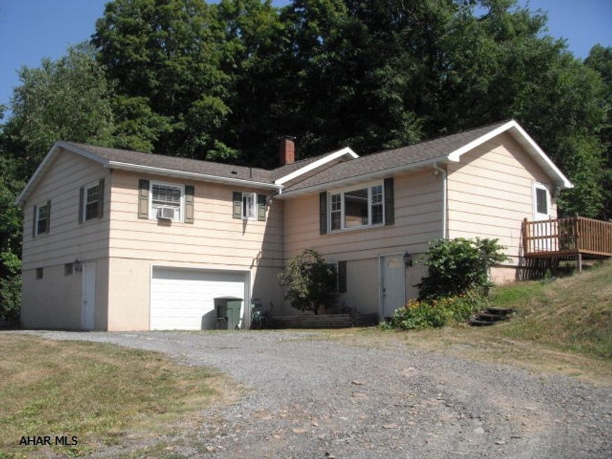 Spacious 3 bedroom, 3 bathrooms raised ranch on 7 semi-private acres, 5-bay dog kennel, lovely county setting.