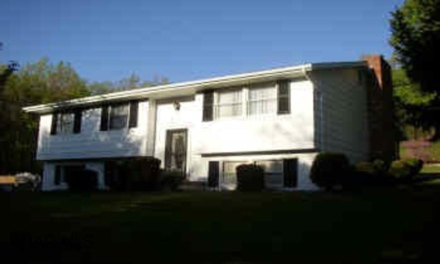 LOGAN TWP. LOW TAXES.  HOME PROTECTION PLAN.  SECLUDED WOODED LOT IN LAKEMONT, NEW ROOF, BATH AND WELL.  SPACIOUS DETACHED GARAGE WITH STORAGE.