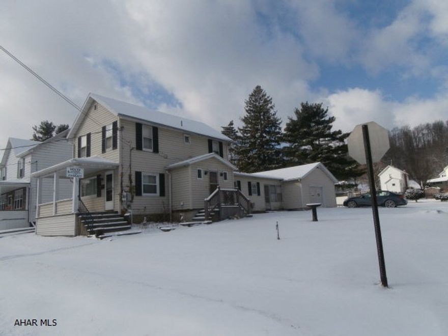 Nice two story with breezeway and attached garage. Garage is a two car size with a one car door. Great location. Large corner lot. Needs some interior updating. Priced to sell.