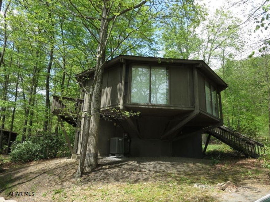 Very nice vacation home (or year round home) located a very short walk from the Omni Bedford Springs Resort. Home overlooks golf course and is in a lovely wooded setting. Wraparound deck affords views of the golf course and surrounding mountains. With main level furniture and appliances included, this home is ready to move into. Soon to open, a hiking/biking trail will allow you a leisurely walk into Historic Downtown Bedford and its many shops and restaurants.