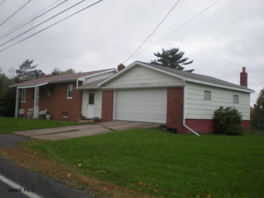 Nice brick and frame rancher on large lot. Breezeway between house and garage. Rear deck. Partially finished basement with woodburner. Coal and oil fa heat. A lot of house for the $$.