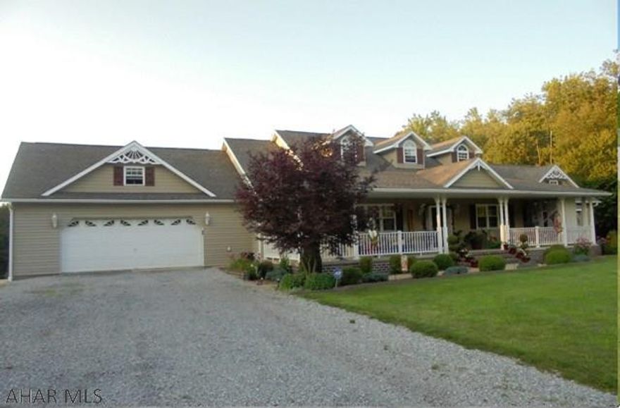 Vinyl sided ranch home 3BR , 2.5 baths. Large kitchen with breakfast bar.  Living room with propane fireplace.  Oil HW Baseboard heat. 4 car garage.on 2 acre lot