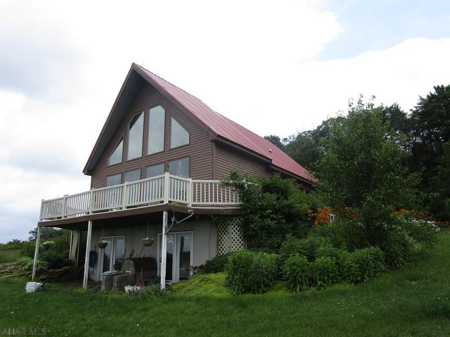 Beautiful A-Frame home on 36.7 acres near St Augustine. Built in 1996 this home has living room with vaulted ceiling and open kitchen, dining area. 2 bedrooms on 1st floor (one could be used as an office, etc.) and 1.5 baths. Second floor loft bedroom and 3/4 bath. Full basement with superior wall foundation. Geothermal heating system.  Living room has large windows and a wrap around deck that show off the million dollar view! Property is approx 90% cleared and has frontage on both Dysart Drive and Carl Road. A bank barn with pastures and hay fields on the property make it a great horse or gentlemen's farm. New metal roof on the home. The view here is breathtaking!!!