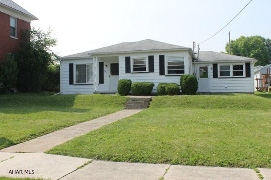Cozy home nestled in a lovely neighborhood in Roaring Spring Borough. Hardwood floors throughout. Attached and detached garages. Large lot with covered patio. Lots of possibilities for the attached garage...could be converted to a living space. House was oil heat at one time, could be changed back. Great price at $89,900.