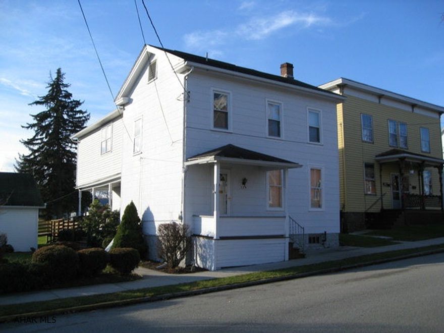 Solidly built, well maintained home just 1 block from Downtown Bedford (located in historic district). Large back yard with many possibilities. Large rooms with almost new carpet (hardwood underneath). First floor air conditioning. Big side porch, 2 car detached garage, move in condition!!