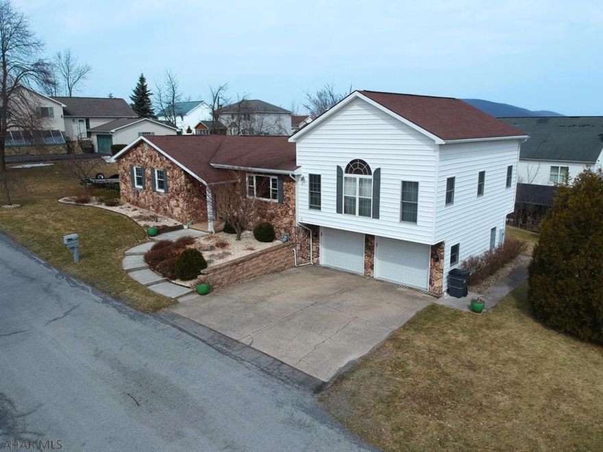 Updated bilevel home in Holiday Heights with countless features!  Hollidaysburg Area School District and Foot of Ten Elementary School.  Kitchen and dining room are open with granite countertops, island, soft close drawers, copper farmer's sink, and included stainless steel appliances.  HUGE master bedroom with vaulted ceilings, radiant heat, gas fireplace, walk-in closet, and en suite bath.  En suite bath has a double vanity, walk-in shower, and jacuzzi tub.  There is a 1st-floor laundry. 3 additional bedrooms which are all large (one with an en suite half bath).  Basement has a wet bar, fireplace, full bath, and sunroom with included hot tub.  An oversized 2 car garage rounds out this awesome home!  Be sure to check out the 3D Tour!