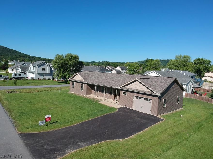 Beautiful new construction in Old Towne Village Hollidaysburg! This 3BR 2.5BA stick built home is 97% complete and ready to meet its new owners! It features an open concept kitchen with fine line cabinets, new granite counters (to be installed shortly), a powered island and a $4,000 allotment for buyers to select kitchen appliances. The large mud room connects the laundry area with the pantry and half bath to the finished garage. Many behind the scenes quality items including a full concrete pad in the crawl space, r30 insulation in the attic, high efficiency windows and doors, water resistant vinyl plank flooring, 40-year roof and a stained concrete garage floor. Still to come are an on-demand hot water heater, water softener and the granite counter tops.