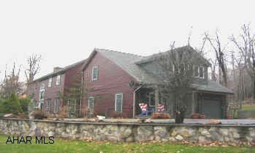 PRIVATE WOODED SETTING ONLY 3 MILES FROM PLEASANT VALLEY BLVD. VERY OPEN AND SPACIOUS HOME.  PROFESSIONALLY LANDSCAPED WITH A POND, MOTHER-IN-LAW APARTMENT ABOVE GARAGE. HORSE BARN WITH PADDOCK.  5 ZONE HEAT, 2ND FLR HAS C/A, STONE FIREPLACE, TILE FLOORS AND 1ST FLR LAUNDRY.