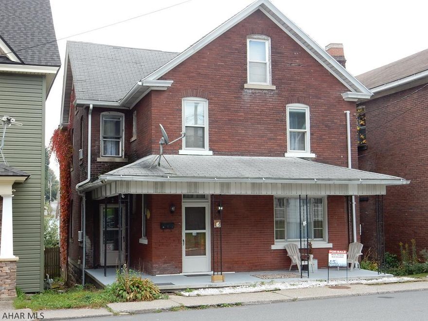 Seller is offering 3% seller assist. This classic Brick with 5 bedrooms, 2&1/2 baths, a fenced yard, a 4 car garage, a covered front porch, a screened in Back porch and back patio is a good find in Gallitzin Borough.  New stainless steel range and french door refrigerator is included.