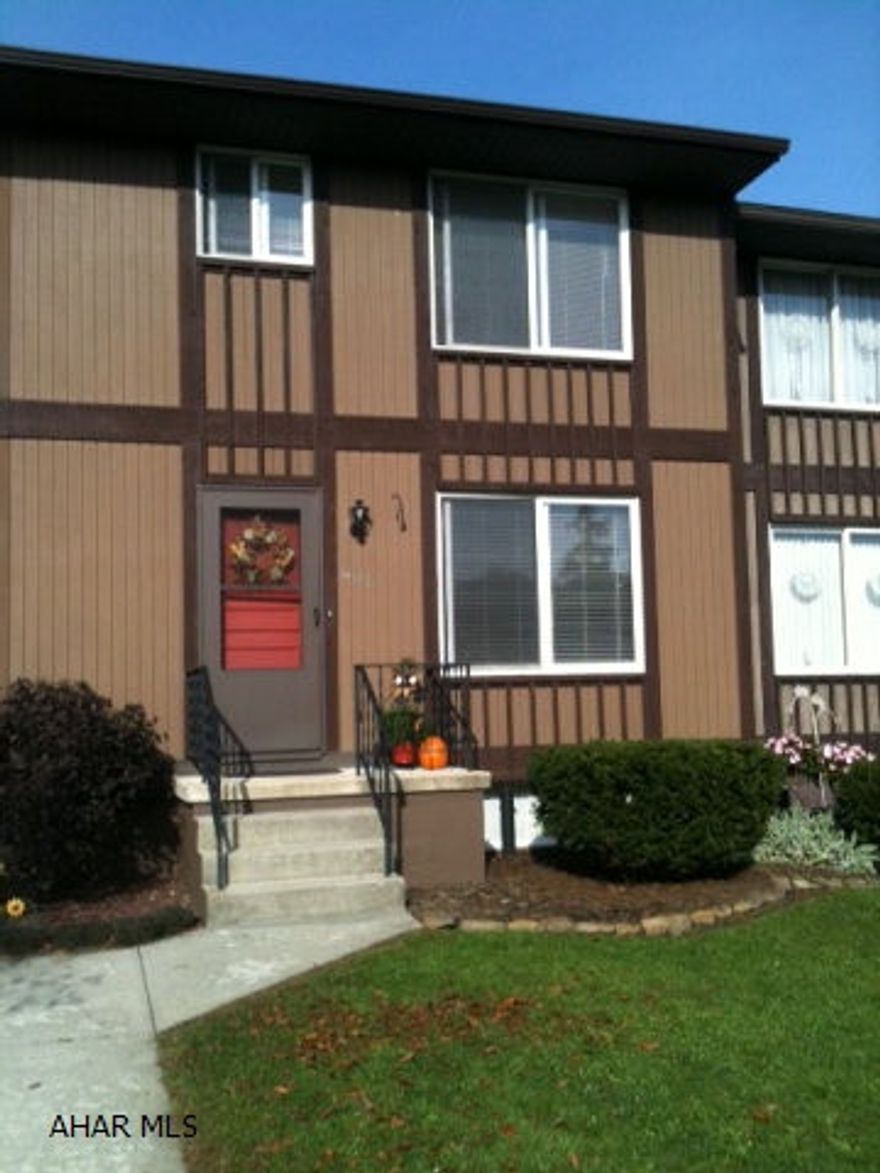 Lower Price!!! IMMACULATE 2 bedroom 1.5 bathroom townhouse.  Priced to sell and BRAND NEW CARPETING!!  Great location, Convenient. Full Basement with washer and dryer.  Gas forced air heat and central air.  Back patio/lawn.  Two Nice Size Bedrooms with lots of storage.  Basement could easily be finished.  Realtor owned. NO flood insurance required.  NO HOA fees. Have a new home for Christmas!
