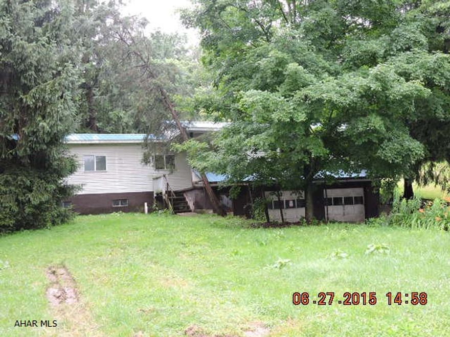 needs tlc.  HUD plates & tags are missing.  Foundation may have a leak.  Seller has not completed any inspection and does not have any reports.  This is an as is where is sale.  Nice lot only minutes from Route 22/I99 interchange.  On site water might be a well.  Public sewer.